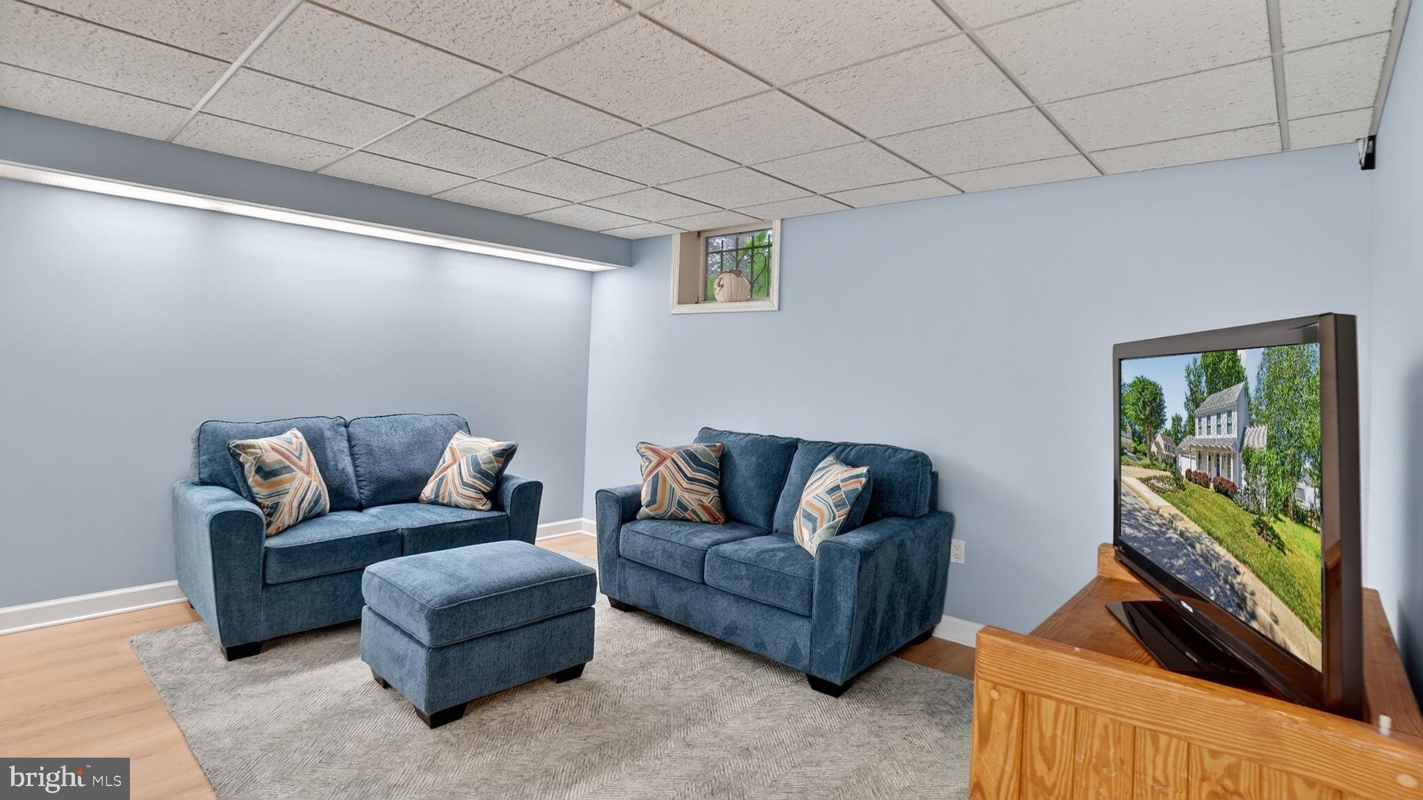 317 Canterfield Road Annapolis, MD 21403 - Photo 48 of 66 a living room with furniture and a flat screen tv