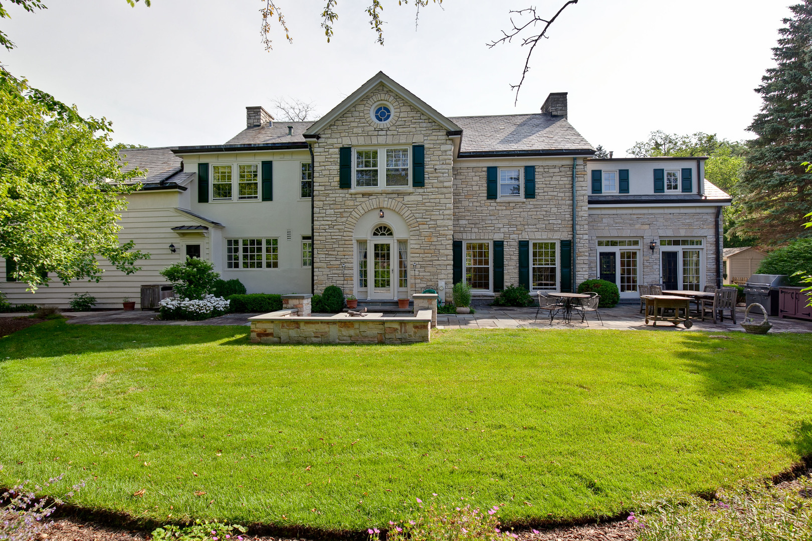 340 King Muir Road Lake Forest, IL 60045 - Photo 46 of 49 a front view of a house with swimming pool having outdoor seating