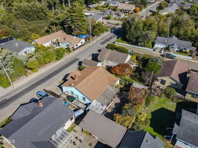 an aerial view of a house with outdoor space