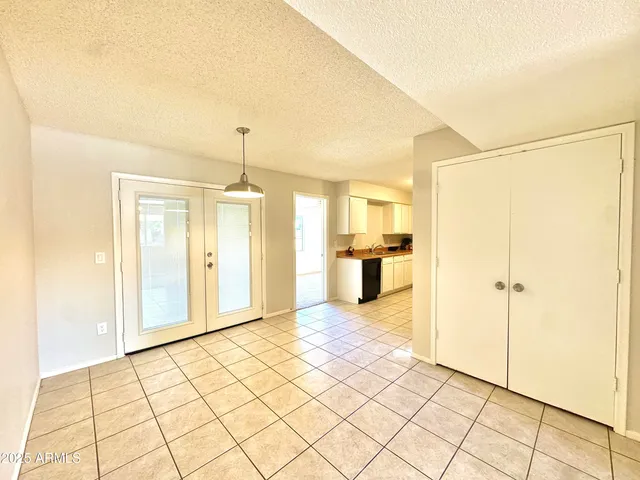 a kitchen with granite countertop a sink and a stove top oven