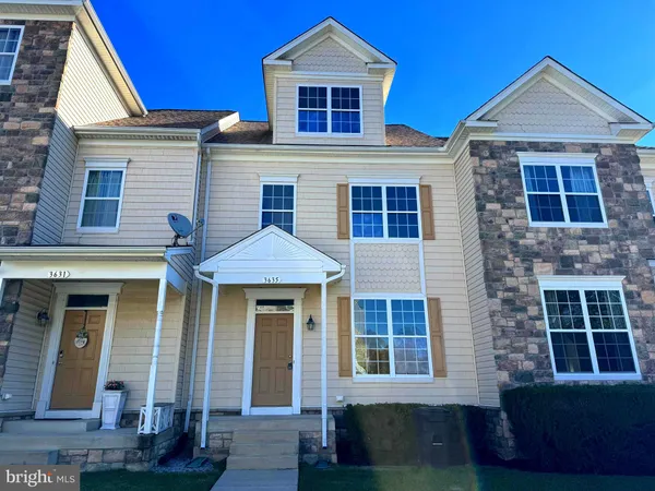 a front view of a house with glass windows