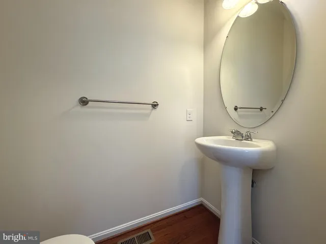 a bathroom with a sink and mirror