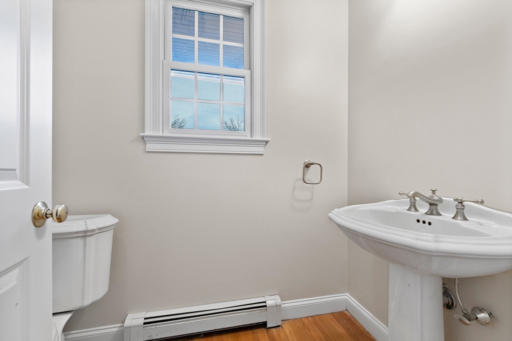 34 Forest Street Hanover, MA 02339 - Photo 16 of 42 a bathroom with a sink toilet and a mirror