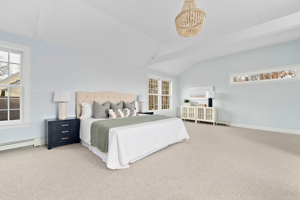 34 Forest Street Hanover, MA 02339 - Photo 20 of 42 a spacious bedroom with a bed and a table