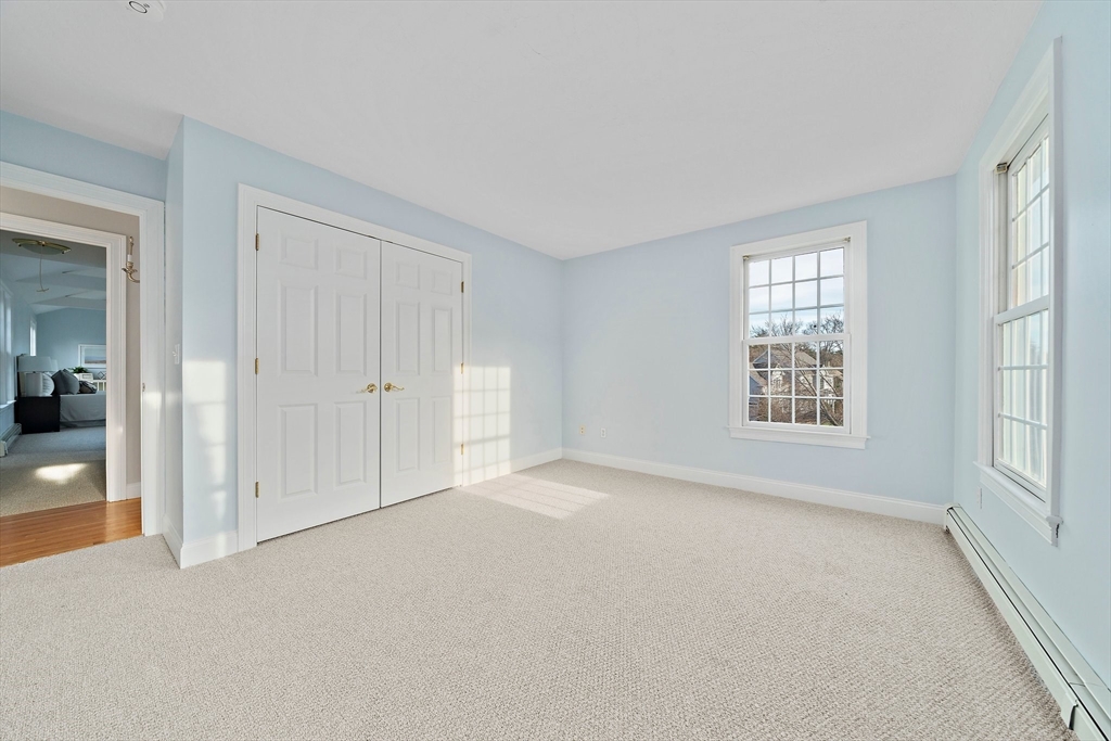 34 Forest Street Hanover, MA 02339 - Photo 30 of 42 an empty room with windows and closet
