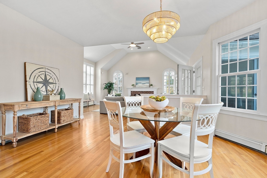 34 Forest Street Hanover, MA 02339 - Photo 7 of 42 a view of a dining room with furniture a chandelier and wooden floor