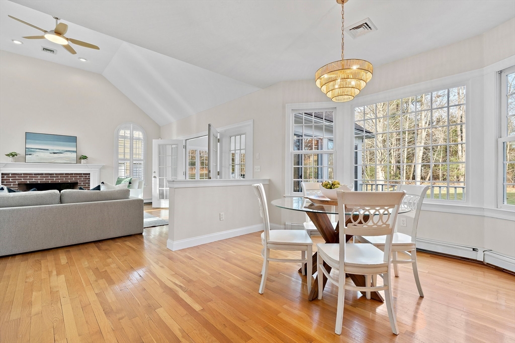 34 Forest Street Hanover, MA 02339 - Photo 8 of 42 a view of a dining room with furniture a chandelier and wooden floor