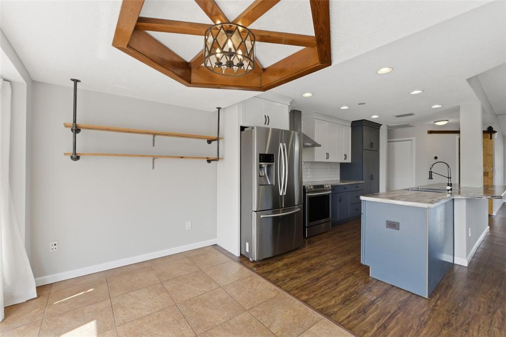 4966 Keysville Avenue Spring Hill, FL 34608 - Photo 23 of 48 a kitchen with stainless steel appliances a refrigerator and a stove top oven