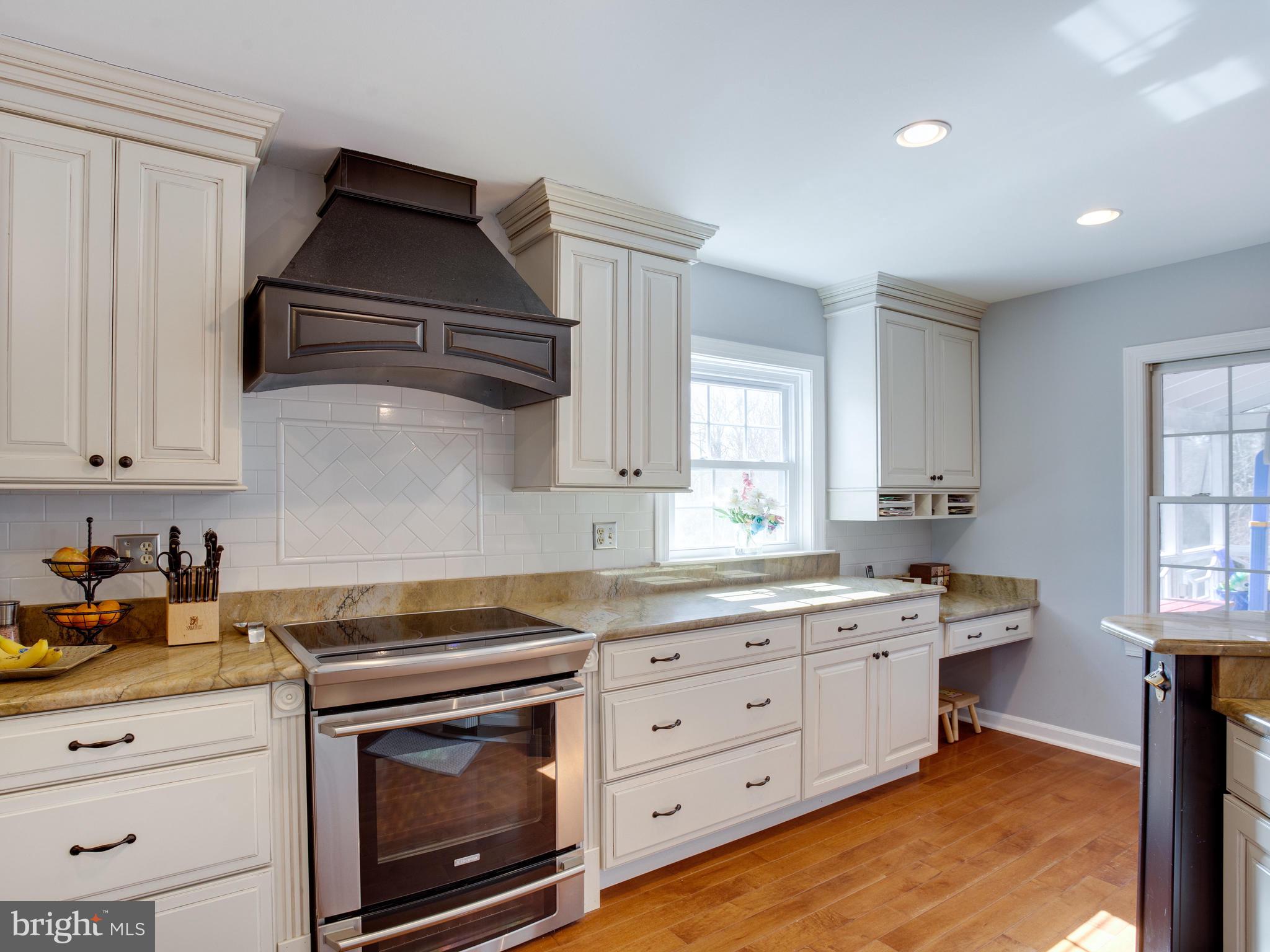 3235 Breckenridge Way Riva, MD 21140 - Photo 13 of 63 a kitchen with stainless steel appliances a stove a sink and cabinets