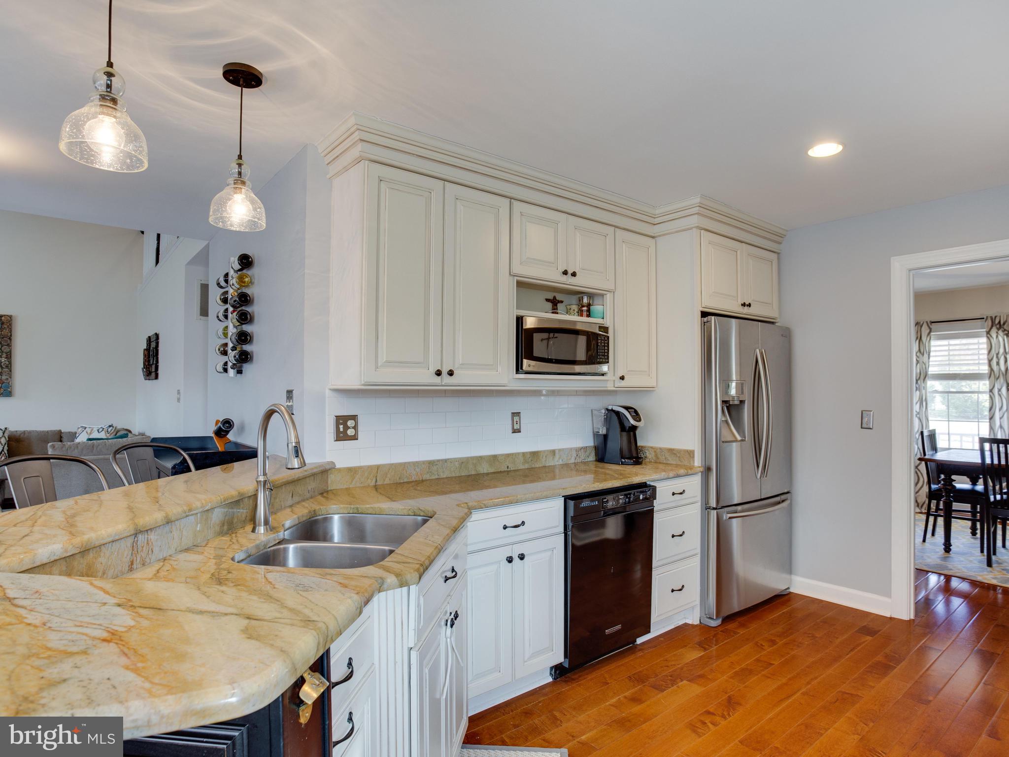 3235 Breckenridge Way Riva, MD 21140 - Photo 14 of 63 a kitchen with a sink refrigerator and cabinets
