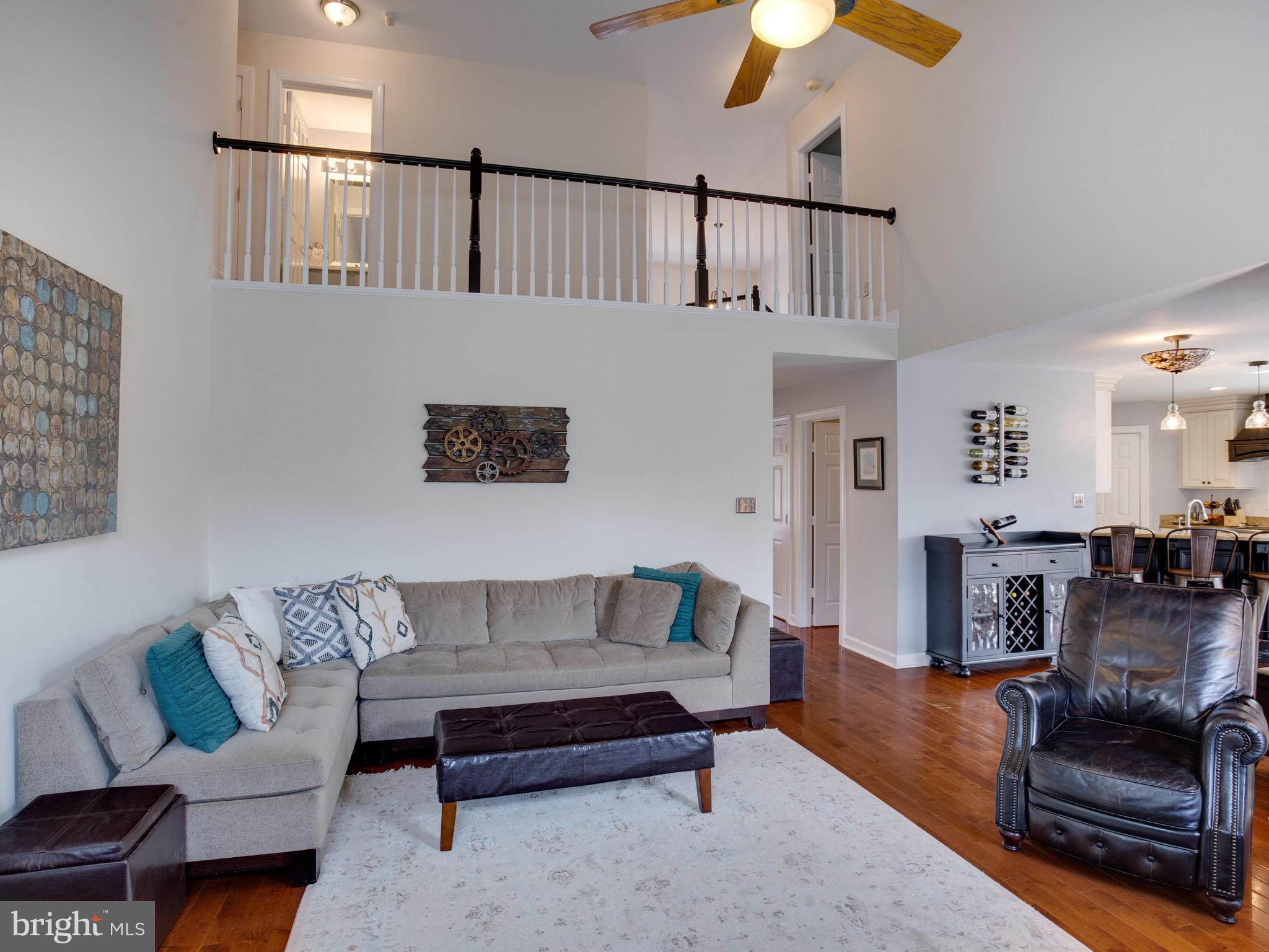 3235 Breckenridge Way Riva, MD 21140 - Photo 20 of 63 a living room with furniture and a wooden floor