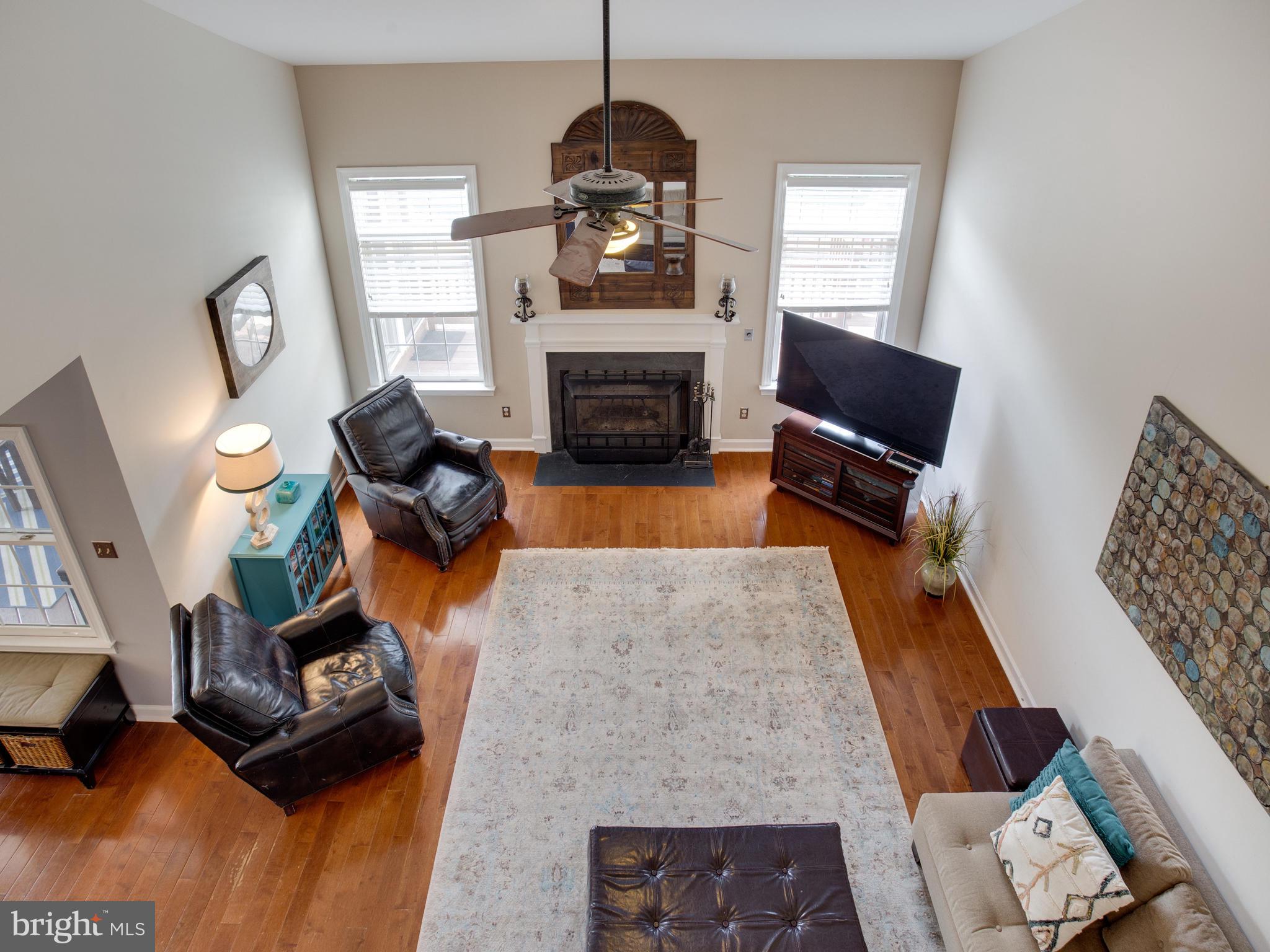 3235 Breckenridge Way Riva, MD 21140 - Photo 23 of 63 a living room with furniture and a fireplace