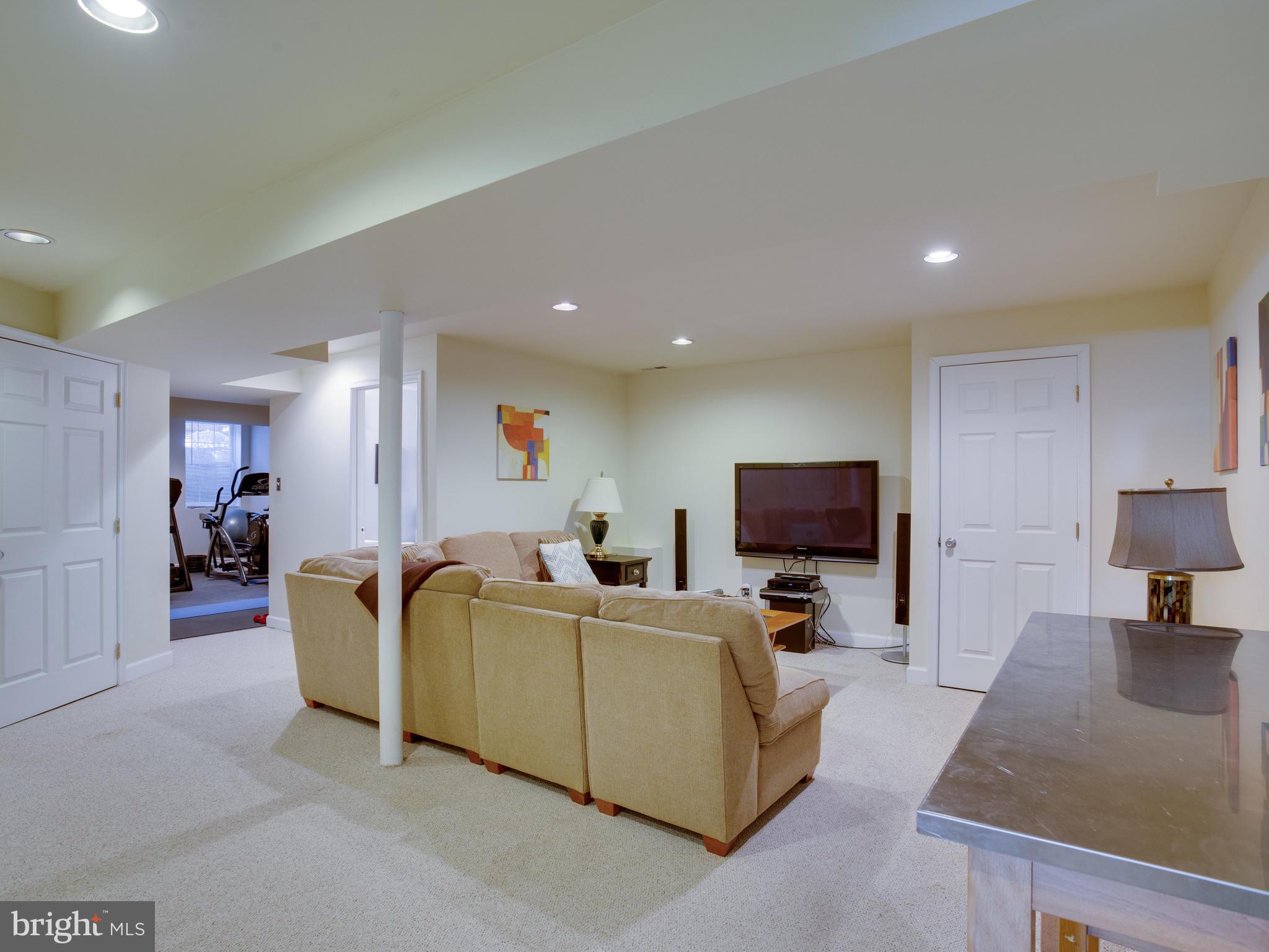 3235 Breckenridge Way Riva, MD 21140 - Photo 38 of 63 a living room with furniture and a flat screen tv
