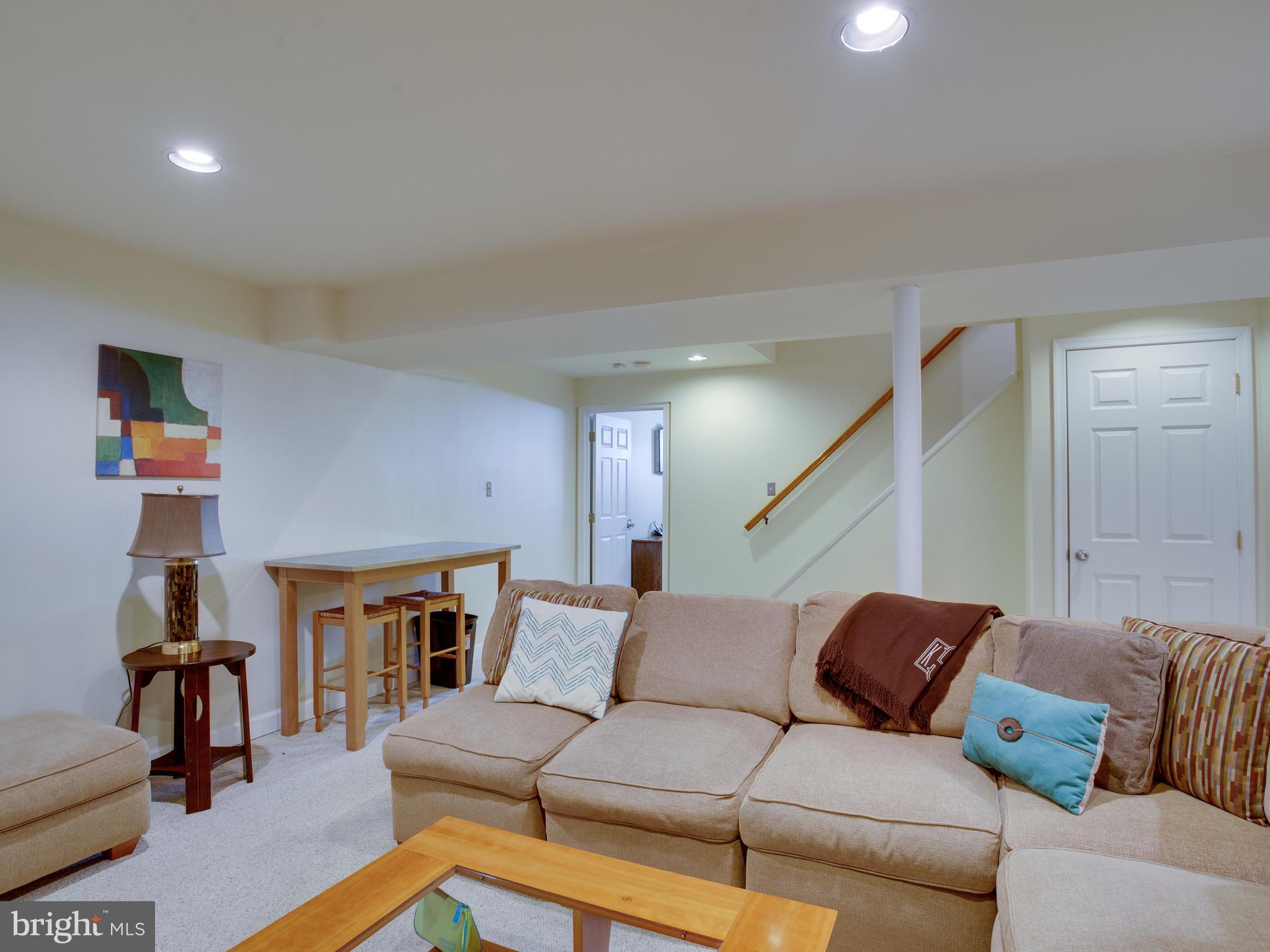 3235 Breckenridge Way Riva, MD 21140 - Photo 39 of 63 a living room with furniture and a fireplace