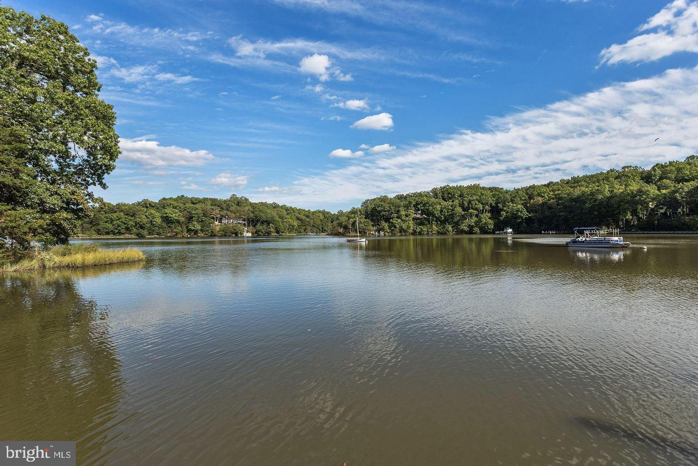 3235 Breckenridge Way Riva, MD 21140 - Photo 55 of 63 a view of a lake with houses in the back