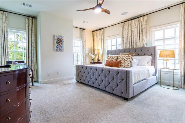 a bed room with a bed and a dresser