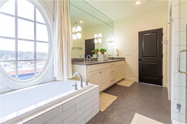 a bathroom with a bathtub and a sink