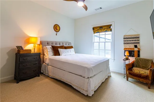 a bedroom with a bed and a couch