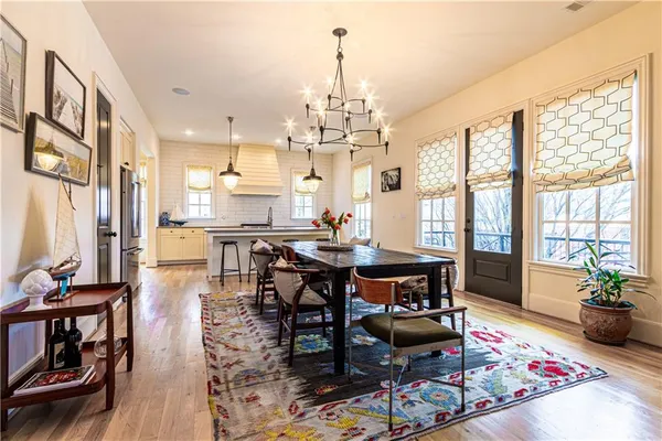 a view of a dining room with furniture window and wooden floor