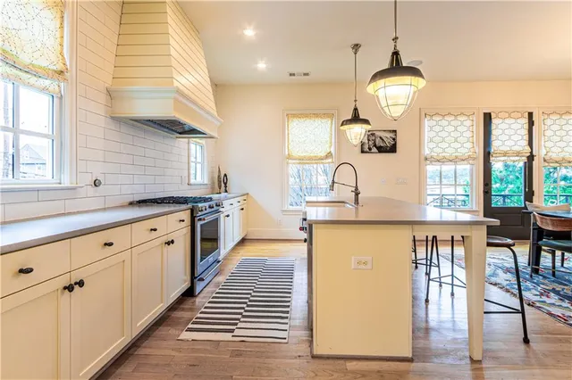 a large kitchen with lots of counter space and window