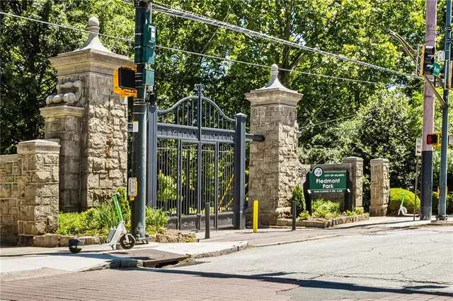a view of a brick building next to a road