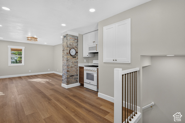 147 Center Street Clearfield, UT 84015 - Photo 34 of 55 Spacious open concept room featuring wood-finish flooring, recessed lighting, and a stone-clad architectural column