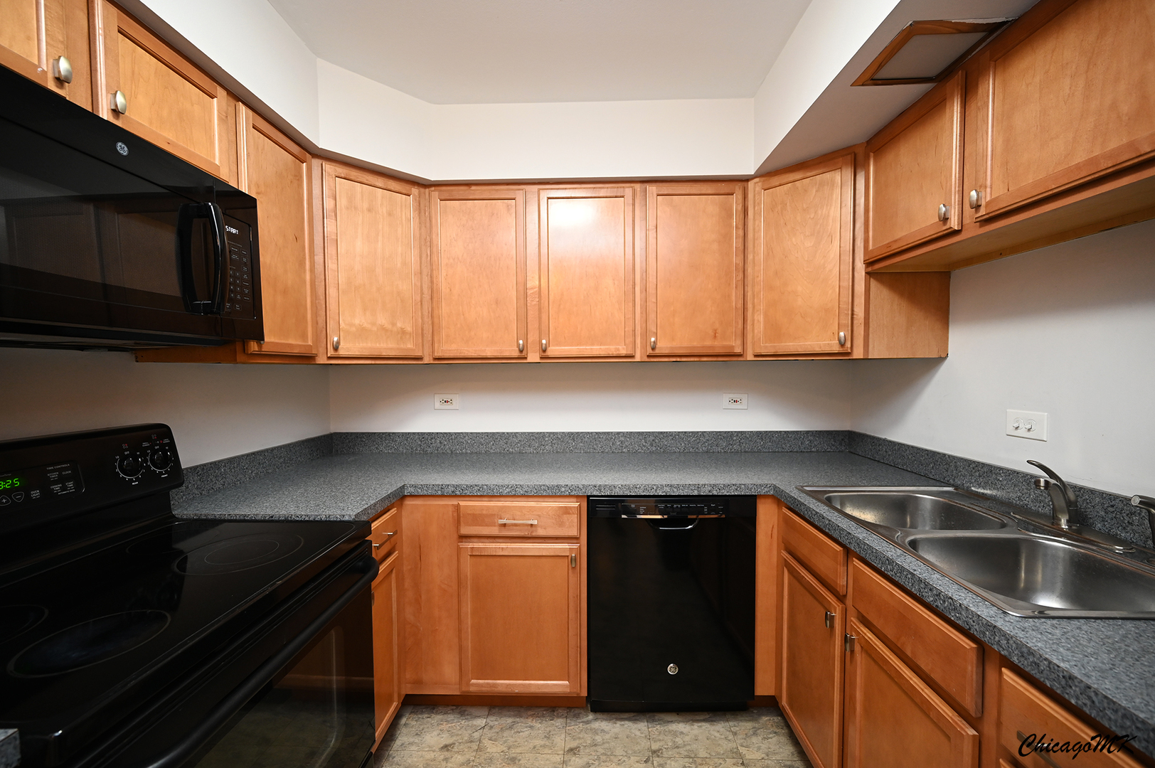 2230 South Goebbert Road, Unit 339 Arlington Heights, IL 60005 - Photo 15 of 38 a kitchen with a sink and cabinets
