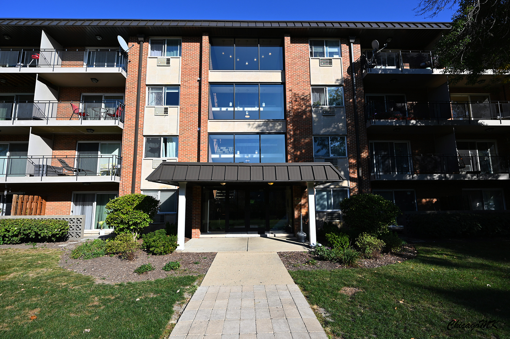 2230 South Goebbert Road, Unit 339 Arlington Heights, IL 60005 - Photo 34 of 38 a front view of a house with a yard