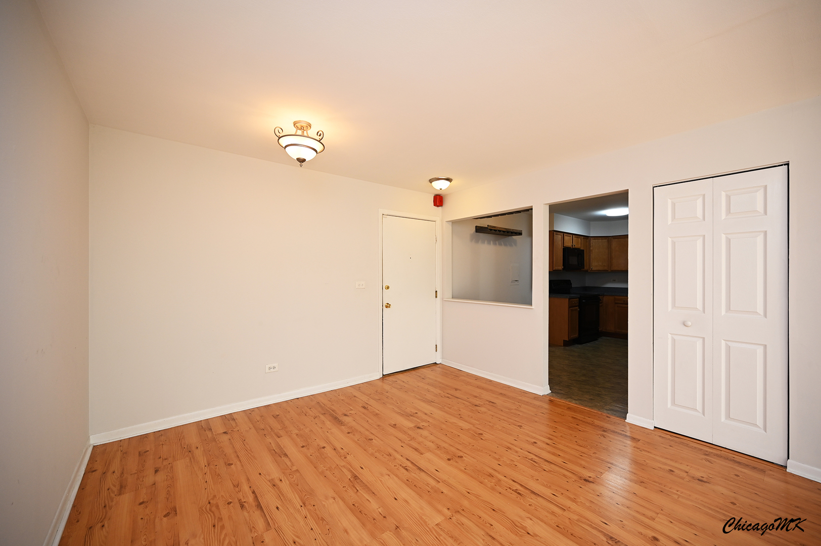 2230 South Goebbert Road, Unit 339 Arlington Heights, IL 60005 - Photo 9 of 38 a bedroom with a bed and cabinets