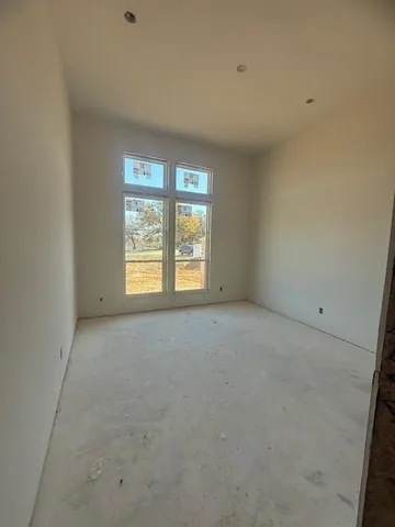 a view of an empty room with a fireplace