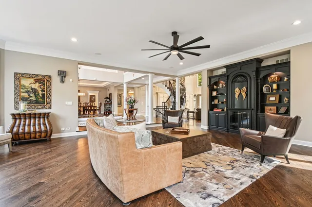 a living room with fireplace furniture and a flat screen tv