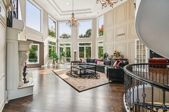 a kitchen with stainless steel appliances granite countertop a stove a kitchen island a dining table and chairs in the kitchen