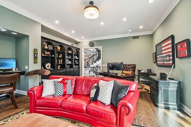 a view of a dining room with furniture large windows and wooden floor
