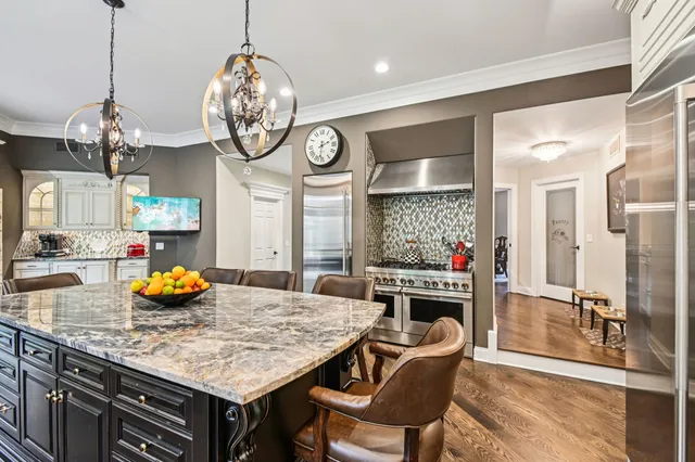 a living room with furniture a ceiling fan and a rug