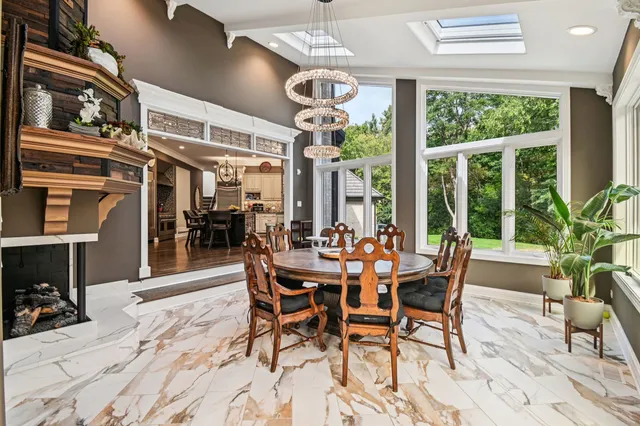 a view of a dining room with furniture and windows