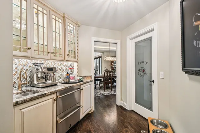 a view of a double vanity sink and a window