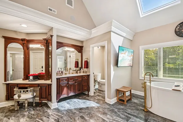 a en suite bathroom with double sink and a mirror