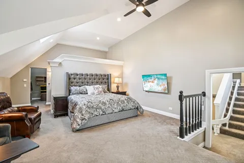 a bathroom with a granite countertop sink a toilet and shower