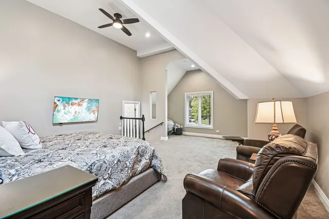 a view of a house with swimming pool and sitting area