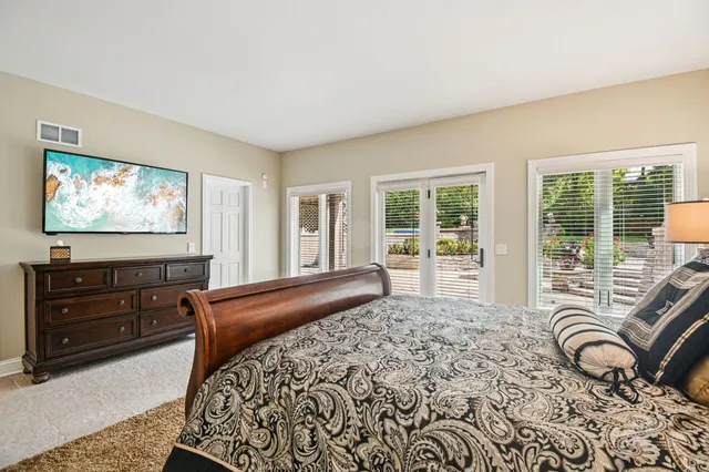 an aerial view of a house with outdoor space and street view