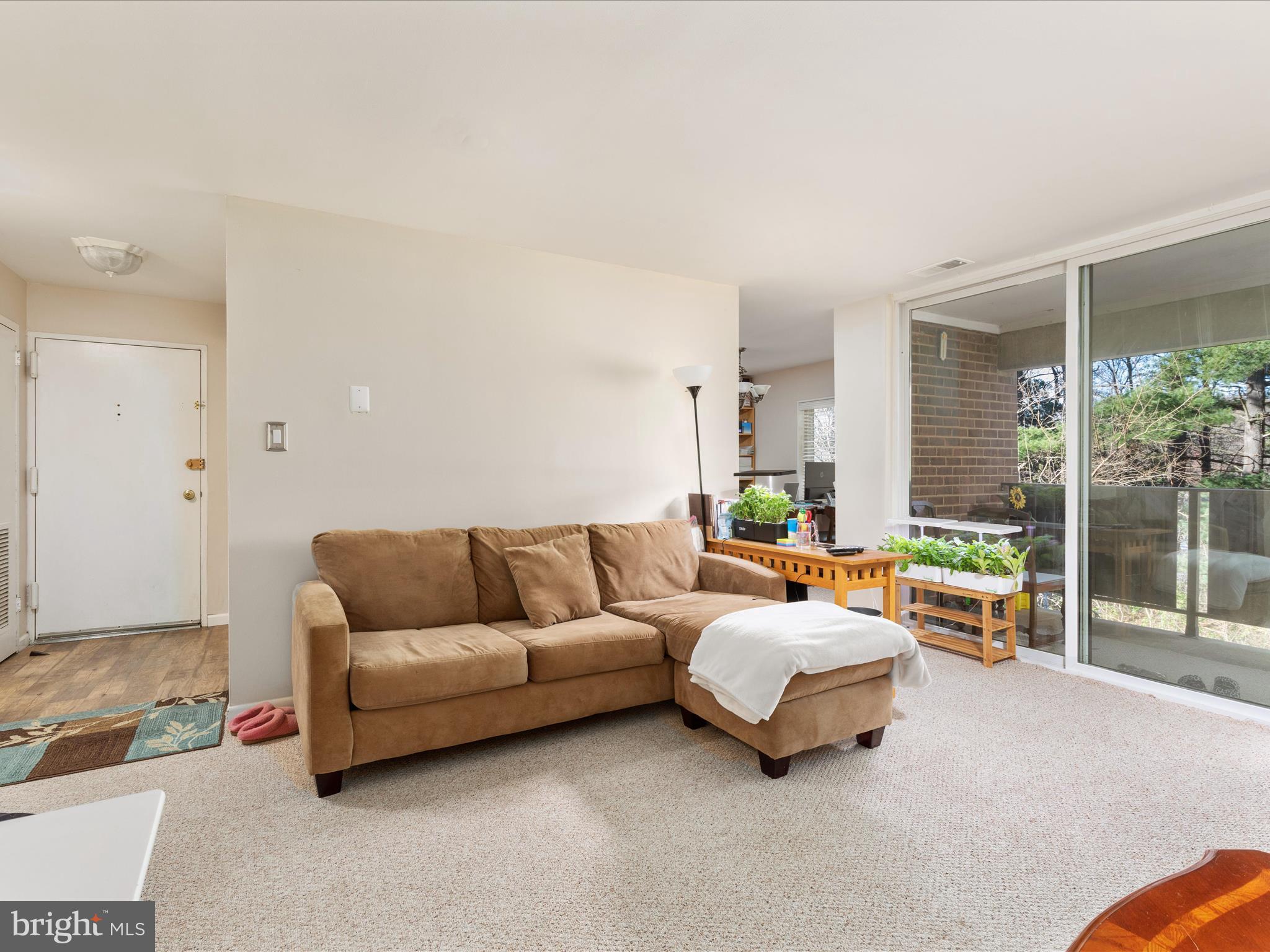 1404 Northgate Square, Unit 140422B Reston, VA 20190 - Photo 3 of 21 Cozy living room!