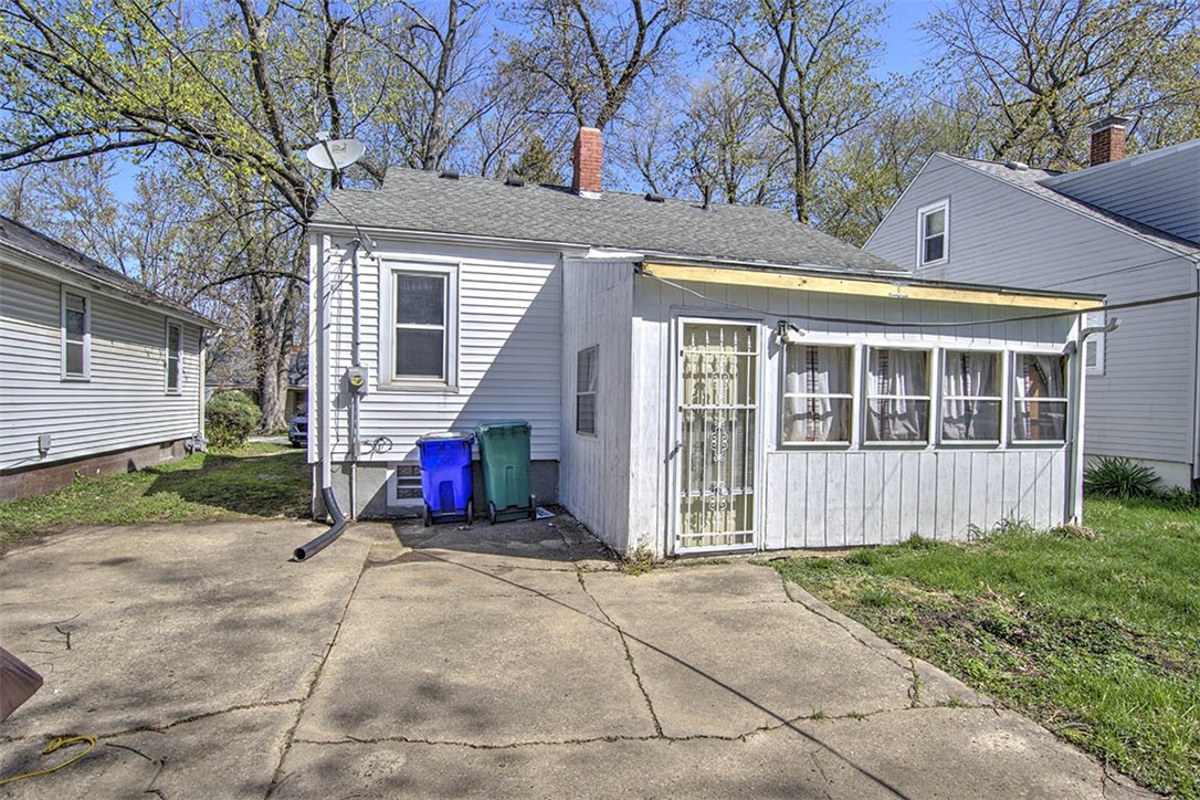 2549 East Main Street Decatur, IL 62521 - Photo 10 of 12 a view of a house with a small yard and large tree