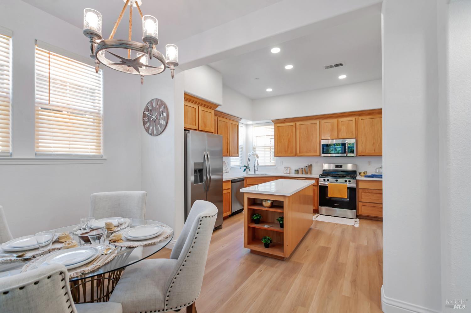 4242 Streamside Drive Santa Rosa, CA 95409 - Photo 14 of 29 a room with stainless steel appliances a table and chairs