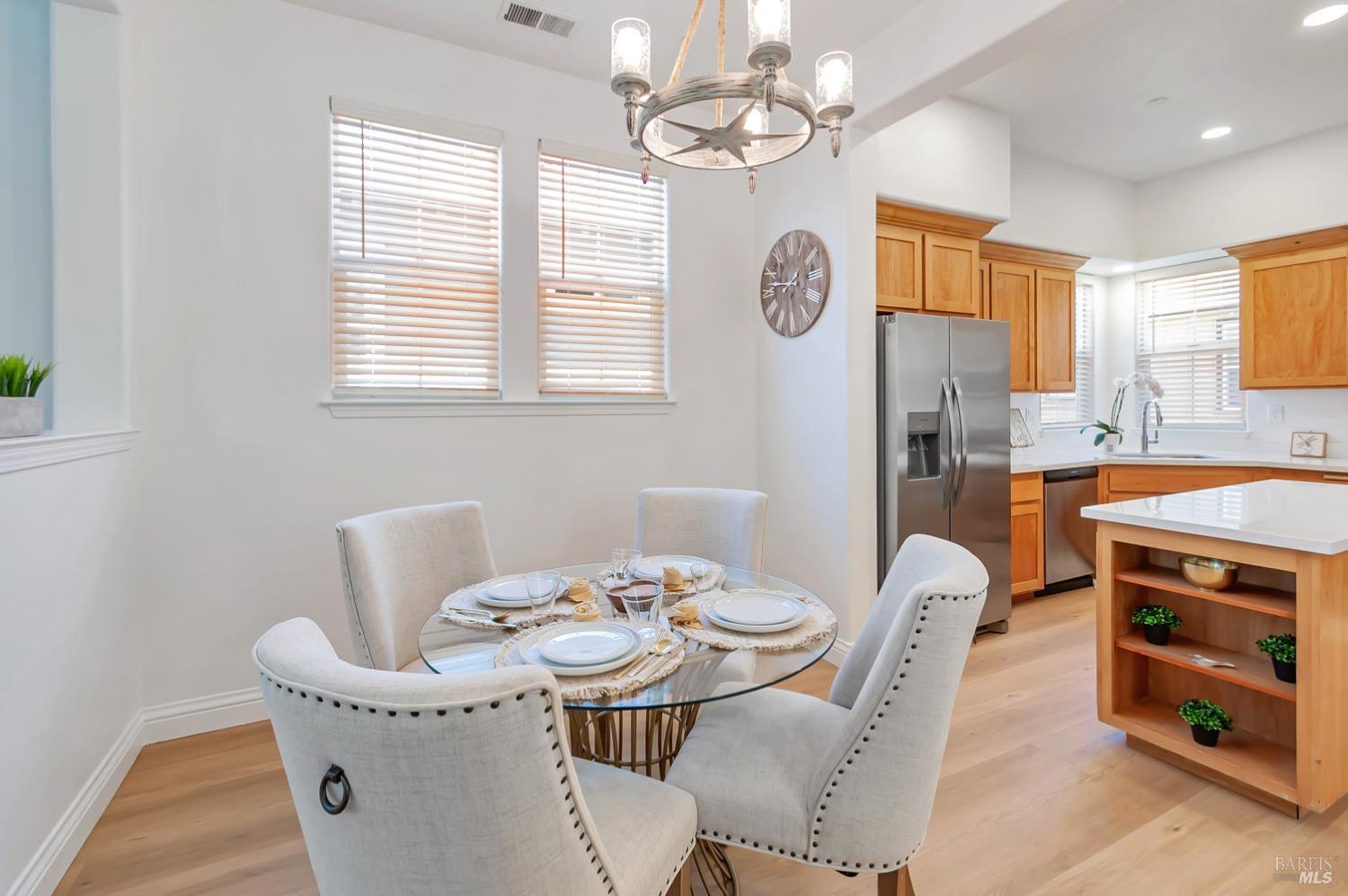 4242 Streamside Drive Santa Rosa, CA 95409 - Photo 14 of 29 a view of a dining room with furniture a chandelier and a window
