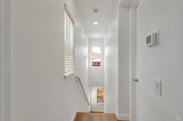a view of a hallway with staircase