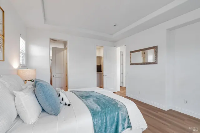 a bedroom with a bed and a lamp