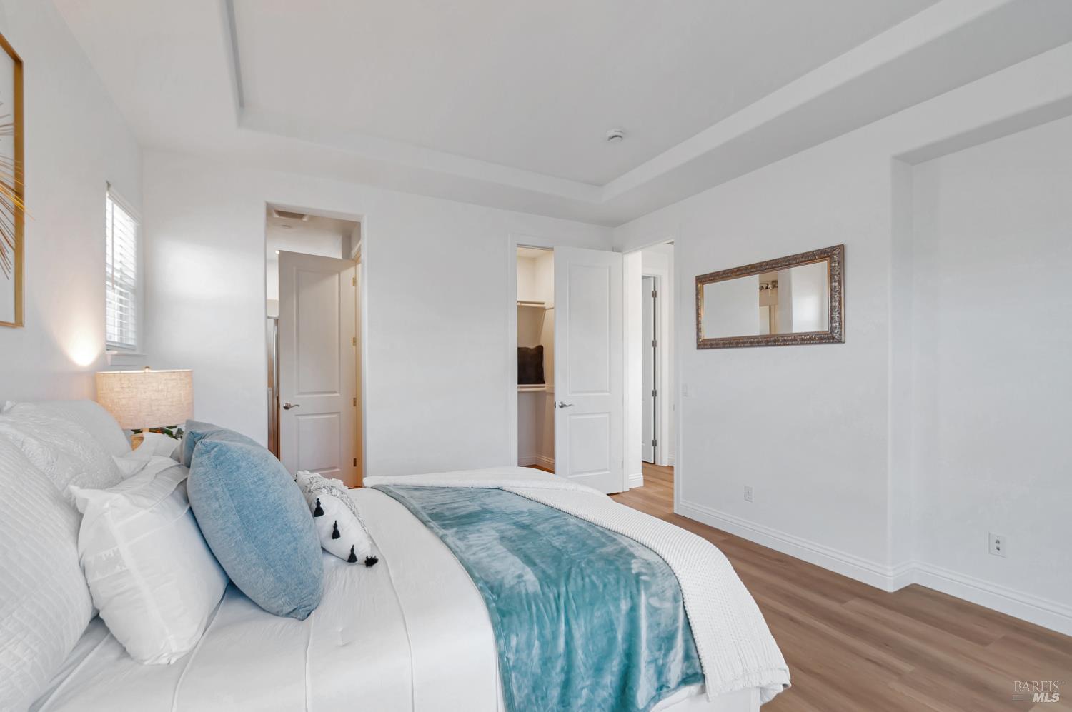 4242 Streamside Drive Santa Rosa, CA 95409 - Photo 19 of 29 a bedroom with a bed and a lamp