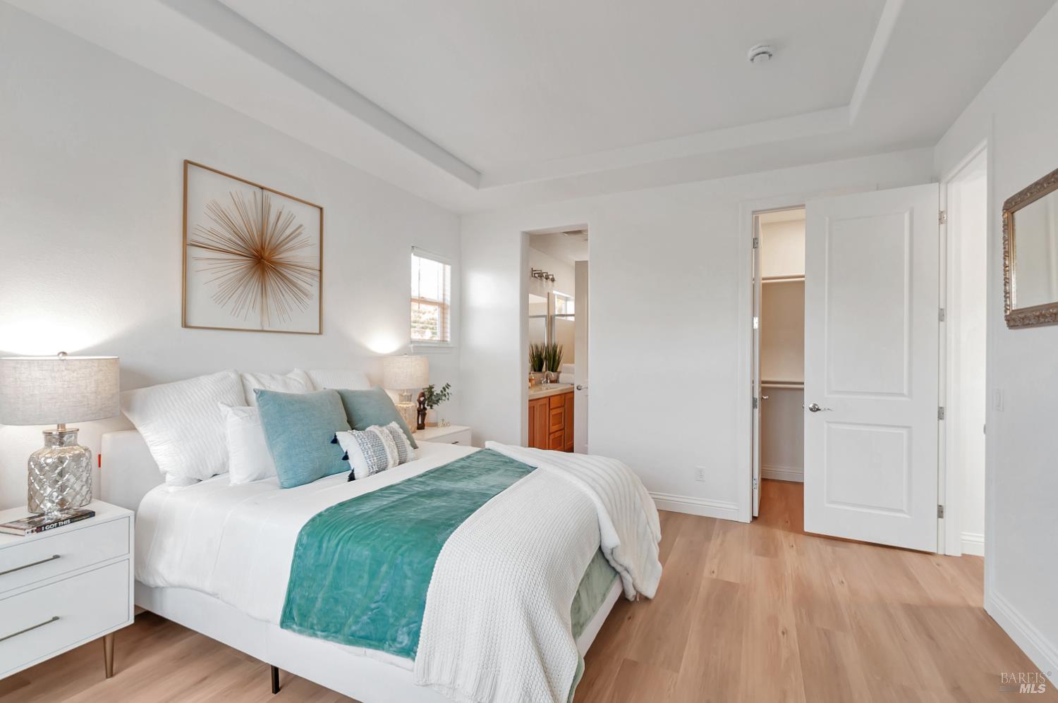 4242 Streamside Drive Santa Rosa, CA 95409 - Photo 19 of 29 a bedroom with a bed and a painting on the wall