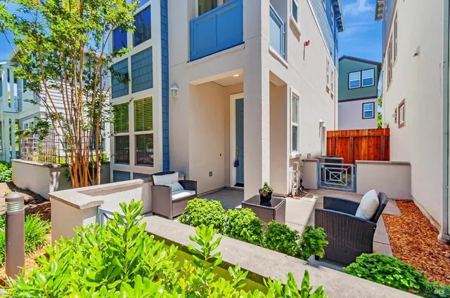 a front view of a building with outdoor seating