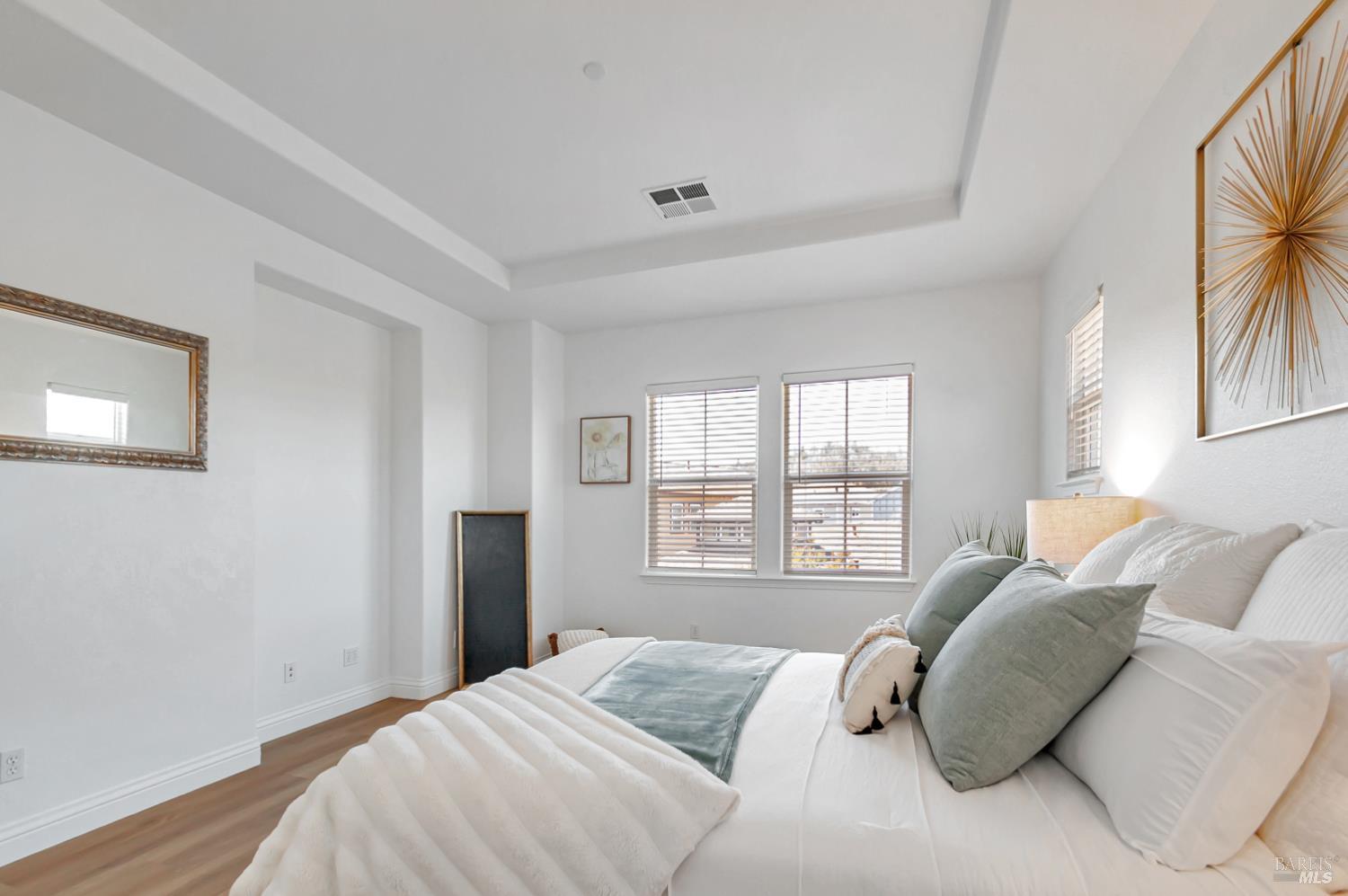 4242 Streamside Drive Santa Rosa, CA 95409 - Photo 21 of 29 a bedroom with a bed and a large window